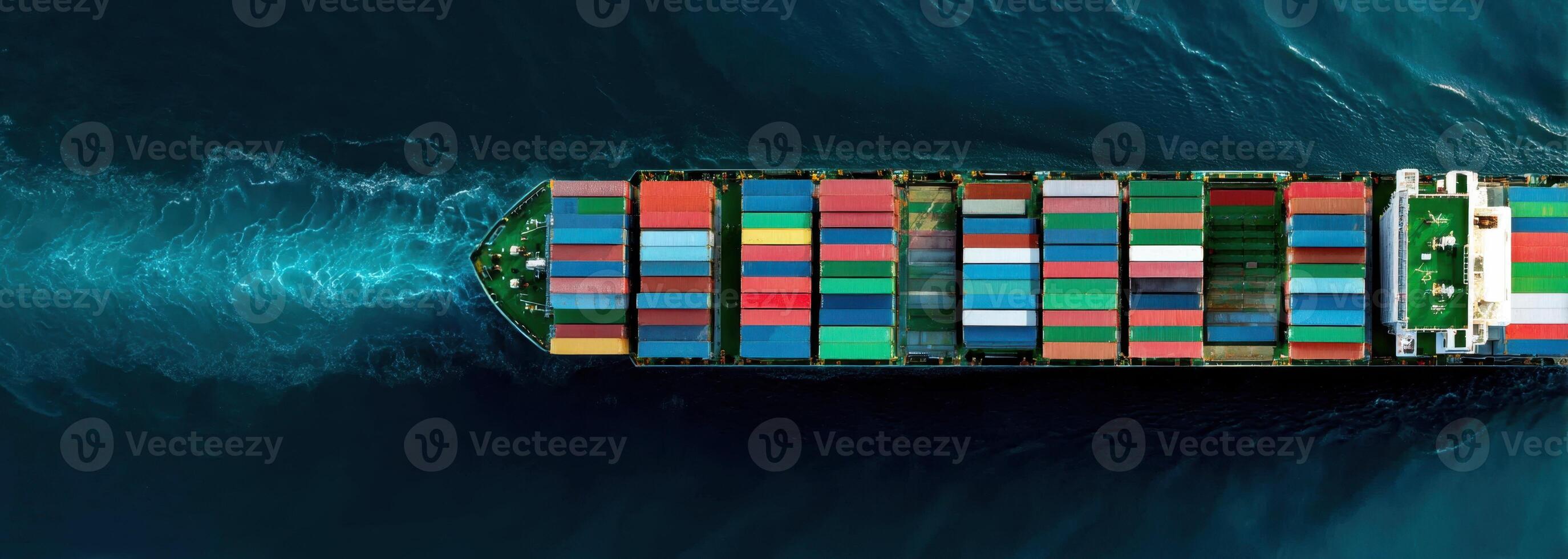 Aerial View of a Large Container Ship Sailing on a Blue Ocean Surface photo