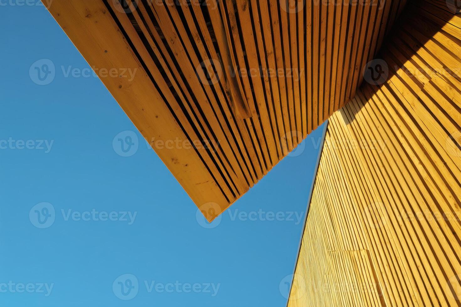 Abstract Geometric Wooden Structure Against Bright Blue Sky Background photo