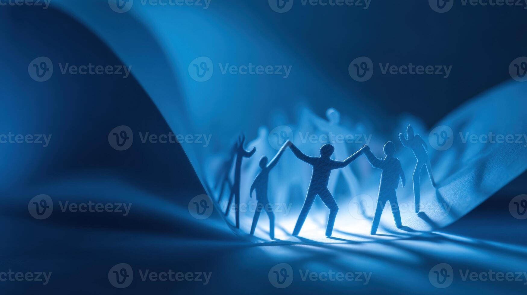 Human Connection Silhouette Holding Hands in the Darkness and in the Light photo