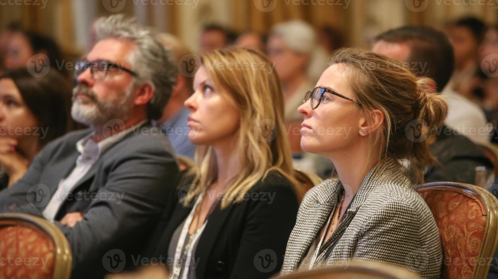 Audience Attends a Conference and Listen to Speakers with Great Attention photo