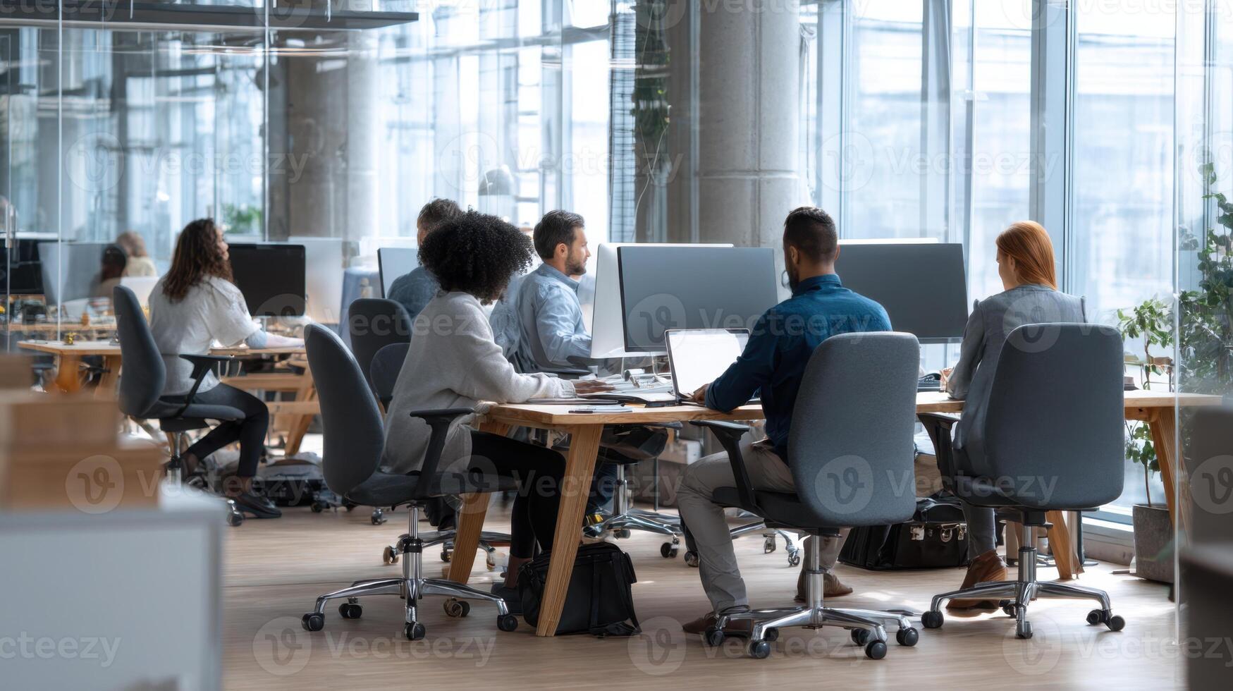 An Office Space With Several People Working At Desks Doing Work photo