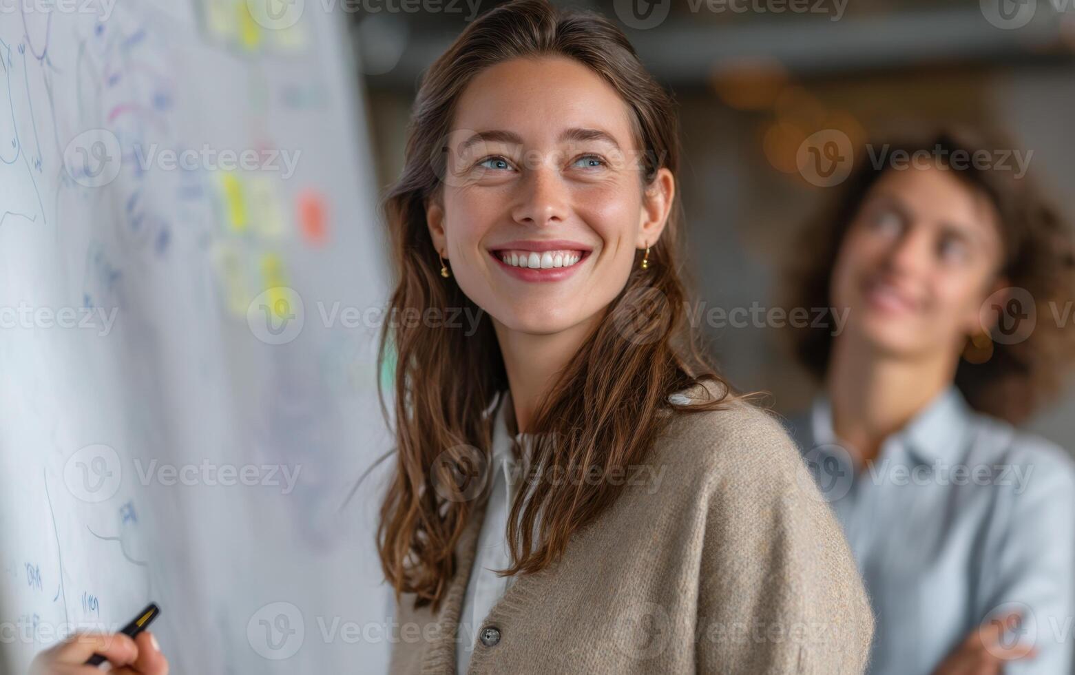 Teamwork in the Office a Young Businesswoman Looking to the Future photo