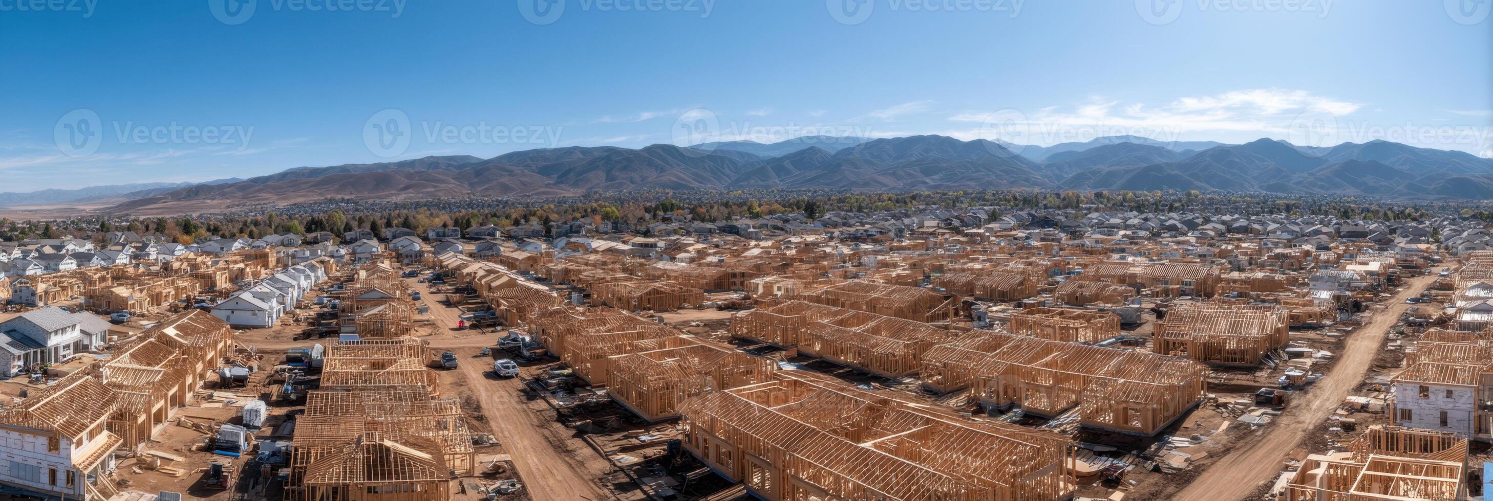 Aerial Vista Shows Dense Suburban Housing Development Sprawling Toward Distant Mountains photo