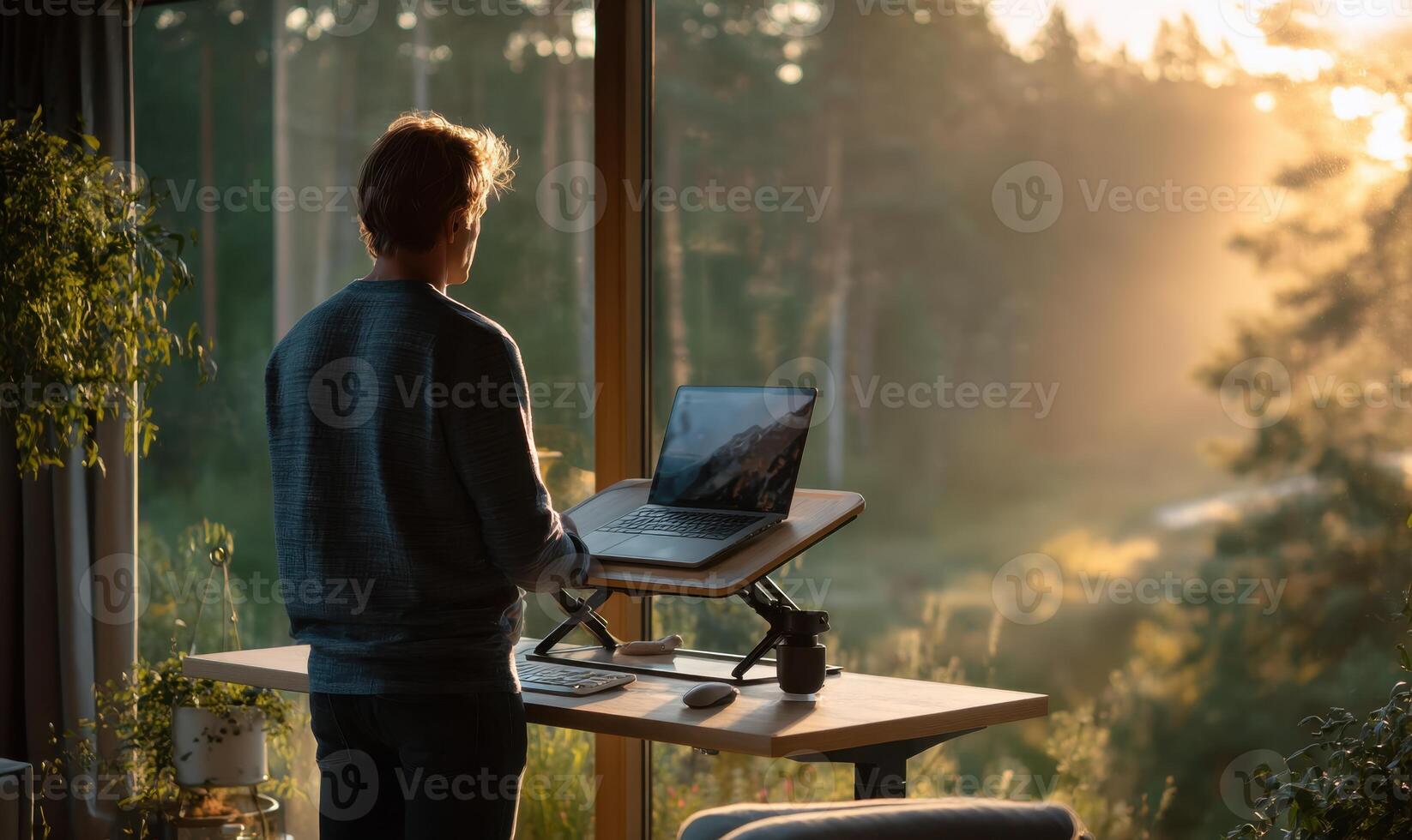A Man Working On Computer In Nature At Home And Feeling Great photo