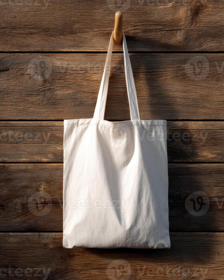 Off White Simple Cotton Bag Hangs on Wooden Hook Wall surface photo