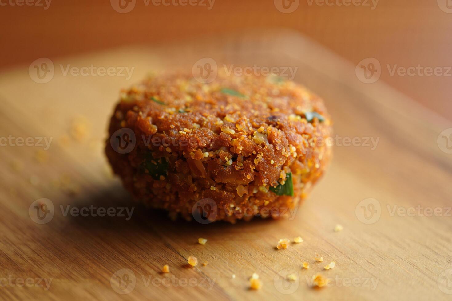 A small food item on a wooden cutting board photo