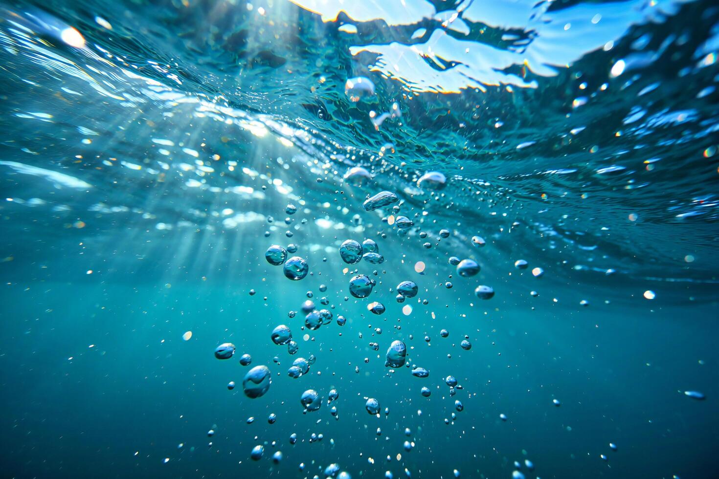 Nature Background Underwater Scene Sparkling Bubbles Rising in Clear Ocean Water with Sunlight photo