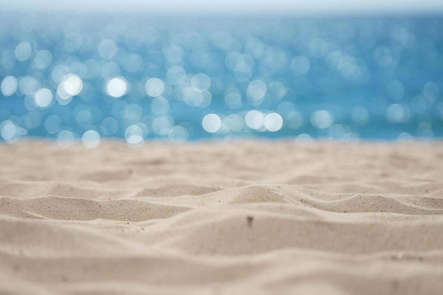 Beach Background Serene Beach Scene Soft Sand and Sparkling Ocean Bokeh Background photo