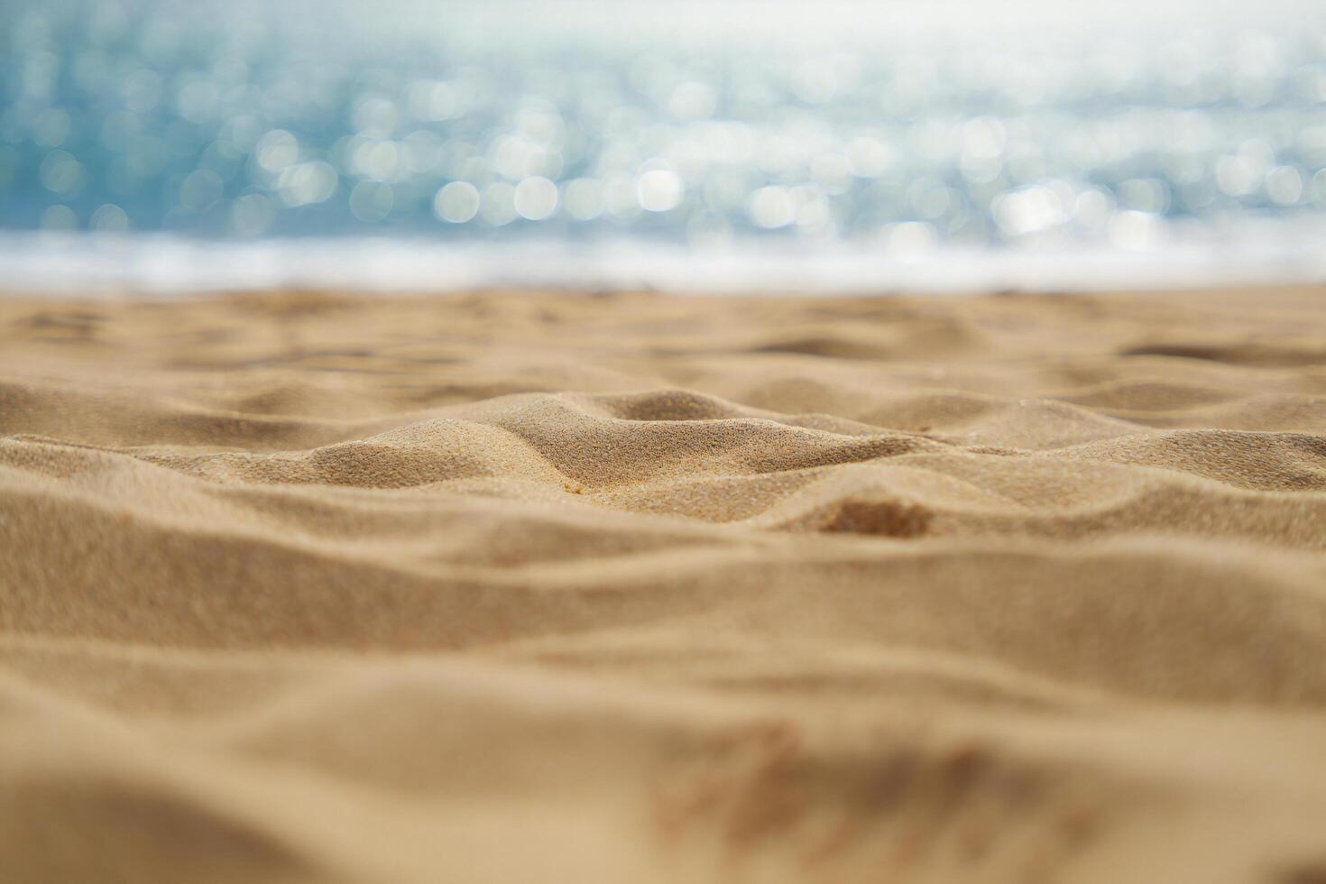 Beach Background Golden Beach Sand Texture with Blurred Ocean Background Summer Vacation Scene photo