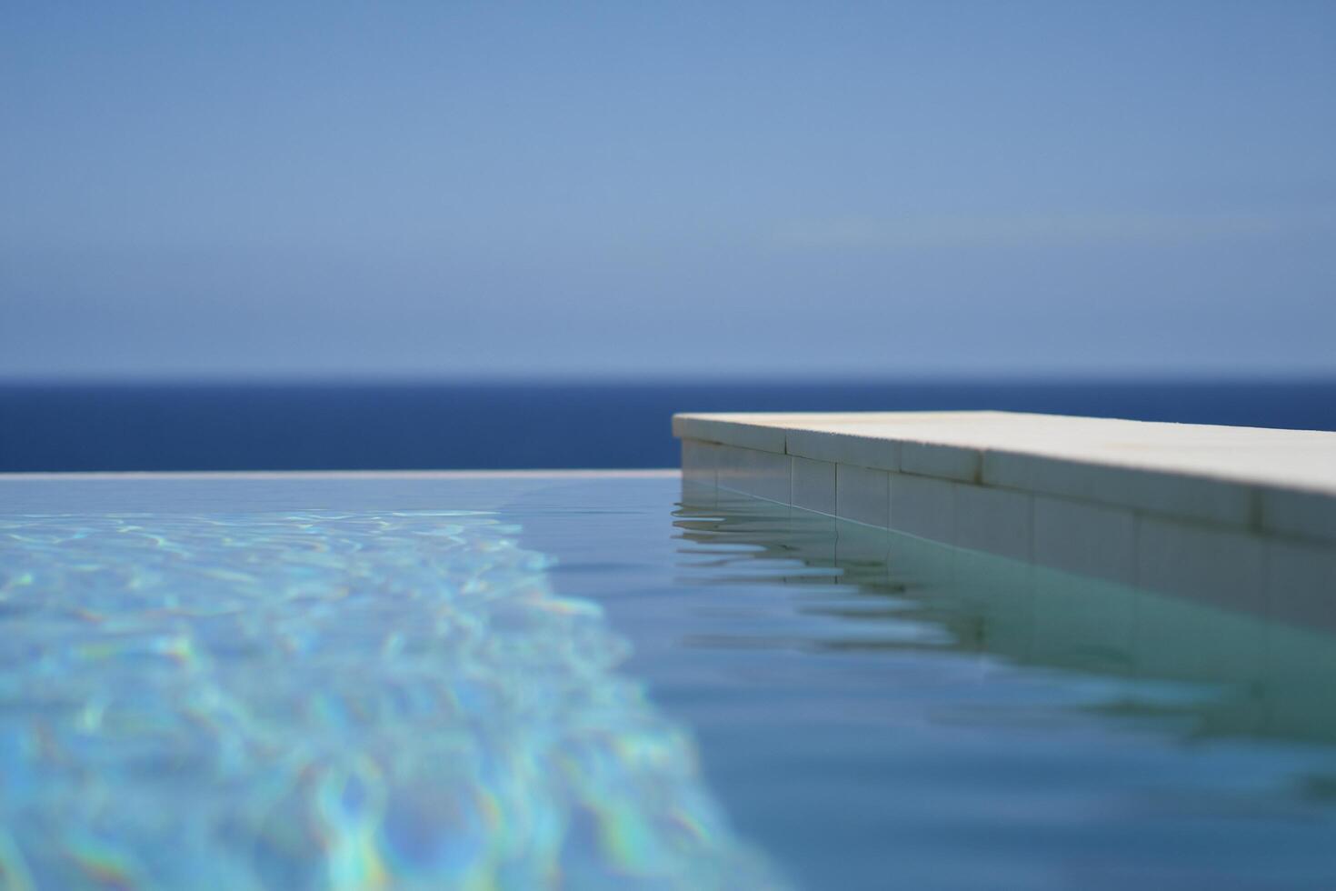 Beach Background Serene Infinity Pool Overlooking Ocean Tranquil Summer Vacation Scene photo