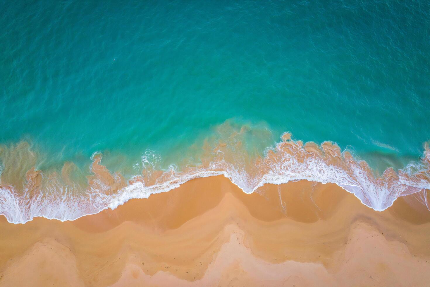 Beach Background Wallpaper Stunning Aerial View of Turquoise Ocean Waves Crashing on Sandy Beach photo