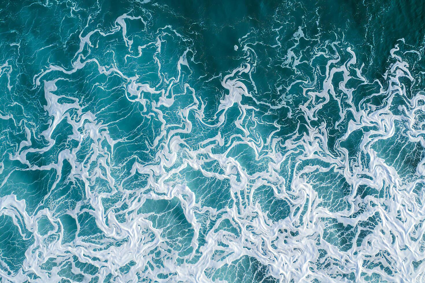 Beach Background Abstract Aerial Ocean Waves Turquoise Water with White Foam Swirls Nature Texture Background photo