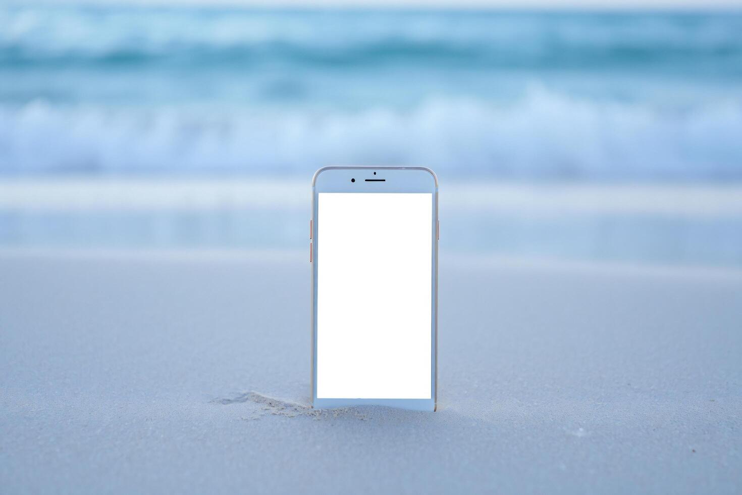 Beach Background Smartphone with Blank Screen on Sandy Beach Ocean Background Summer Vacation Concept photo