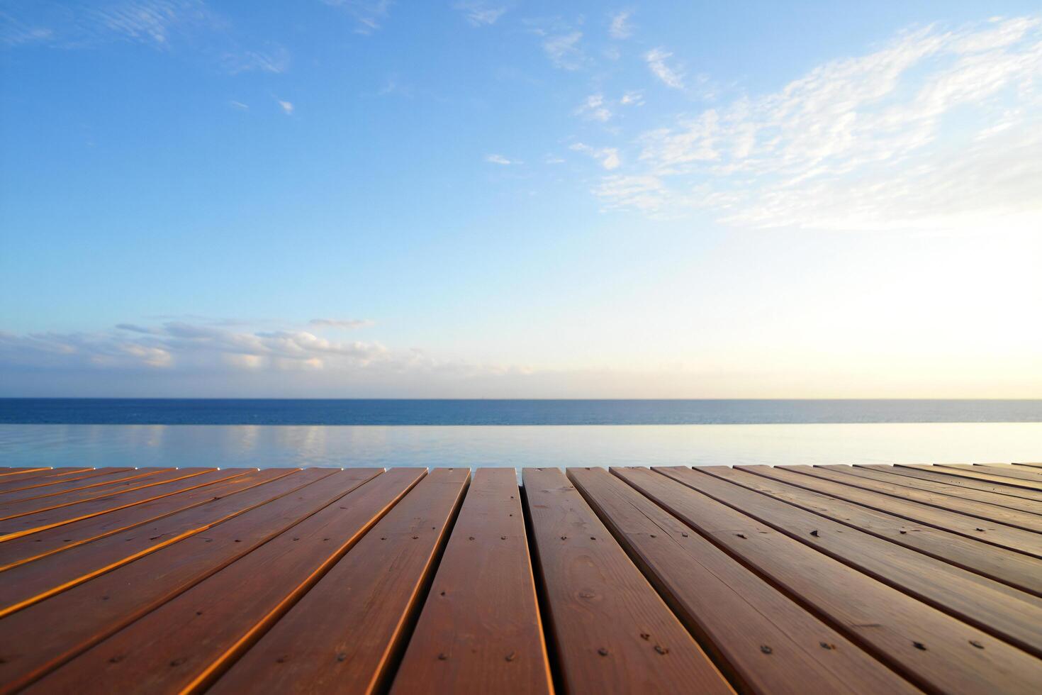 Beach Background Tranquil Ocean View Wooden Deck Overlooking Calm Sea and Sky photo