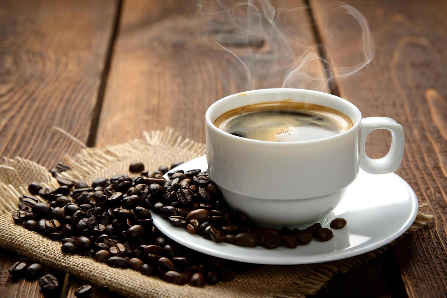 Coffee Background Aromatic Hot Coffee in White Cup with Roasted Beans on Rustic Wood photo