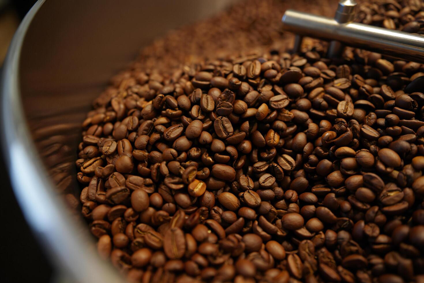 Coffee Background Roasted Coffee Beans in Metal Container Close Up View of Aromatic Coffee Dark Brown Coffee Beans photo