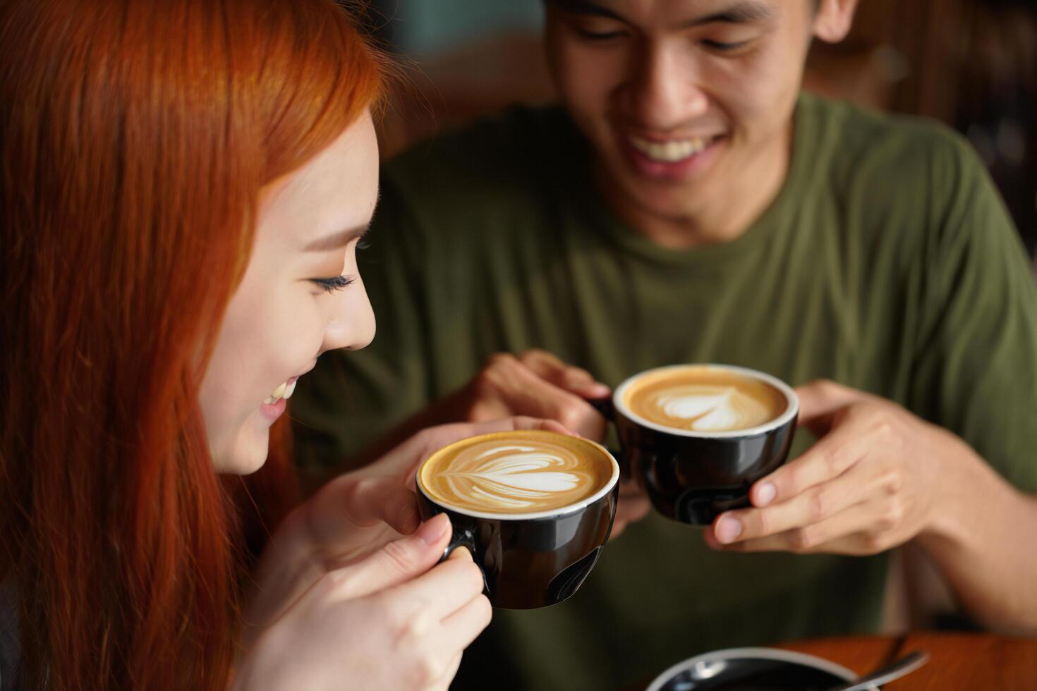 Coffee Background Young Couple Enjoying Latte Art Coffee at a Cafe Romantic Date photo