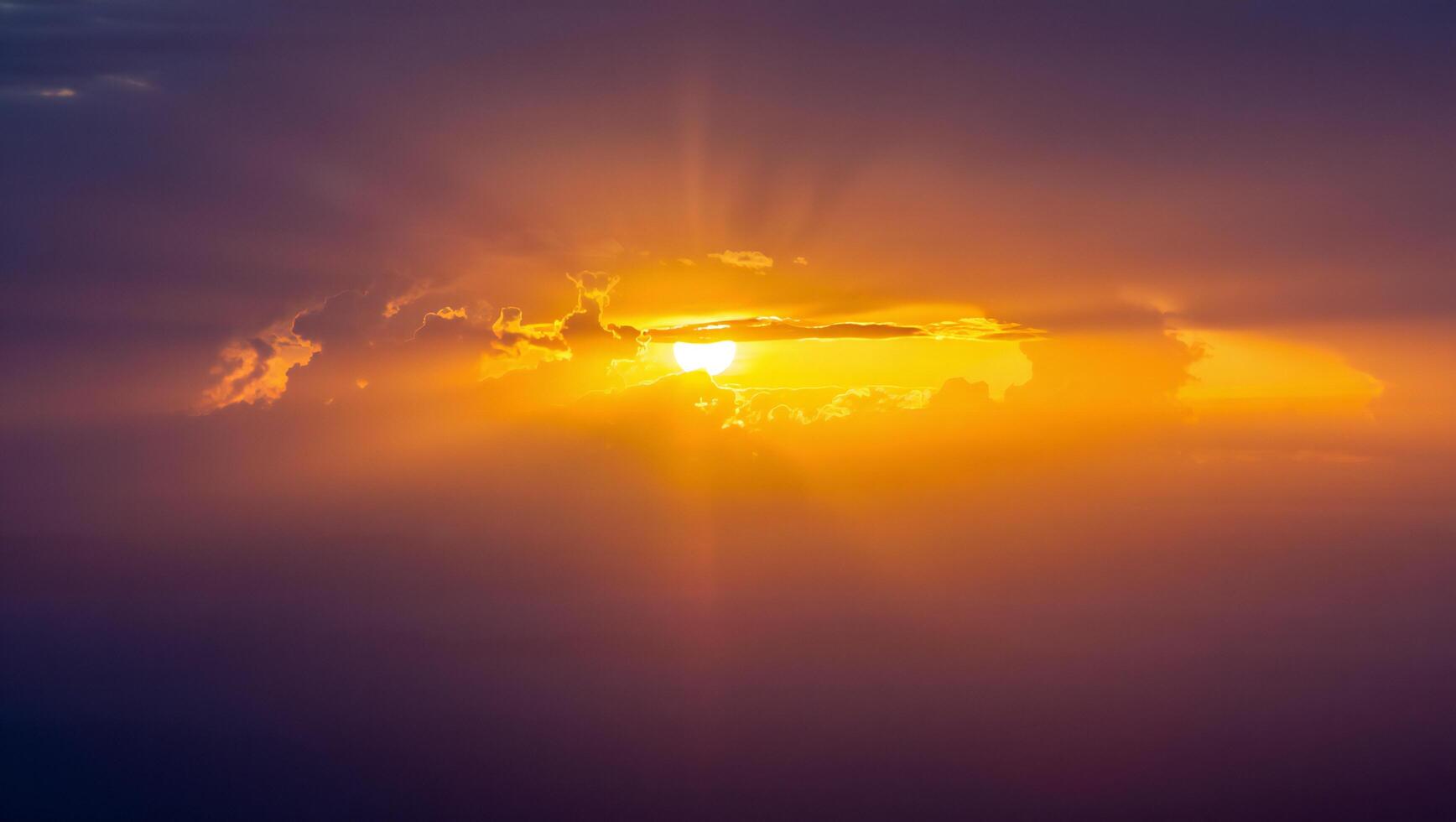 Nature Background Dramatic Golden Sunset Sky with Clouds Fiery Orange and Purple Hues Nature Background photo