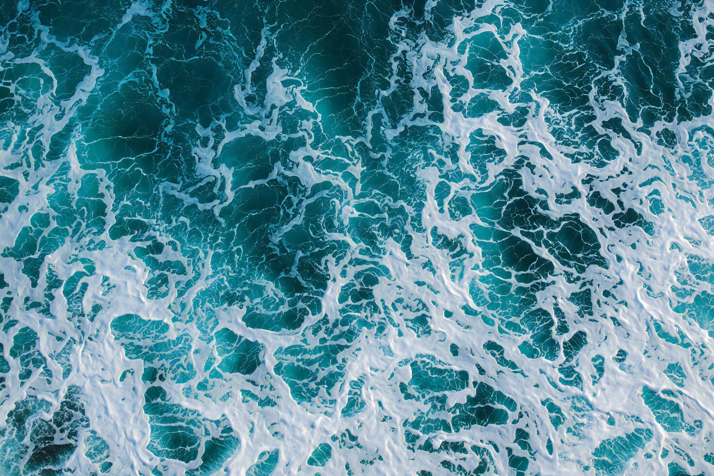 Nature Background Aerial View of Ocean Waves Turquoise Water with White Foam Texture photo
