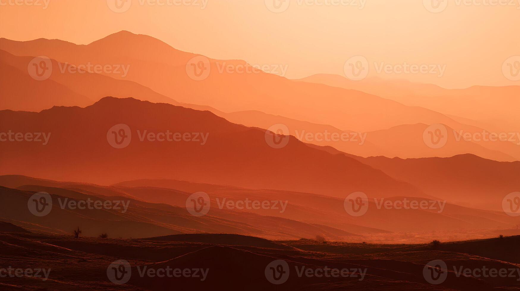 Majestic mountain ranges bathed in the warm glow of sunset creating a scenic landscape view photo