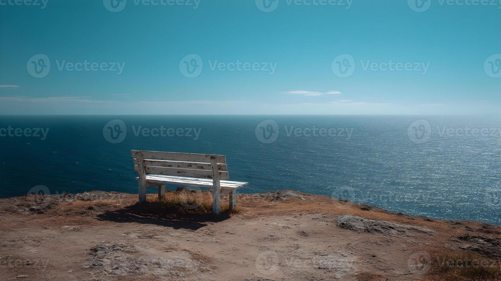 Seaside serenity bench overlooking the endless ocean meeting a calm horizon on a clear day photo