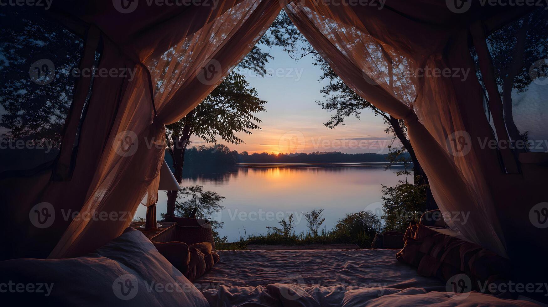 Serene sunrise view from cozy lakeside tent offers peace and tranquility for an escape photo