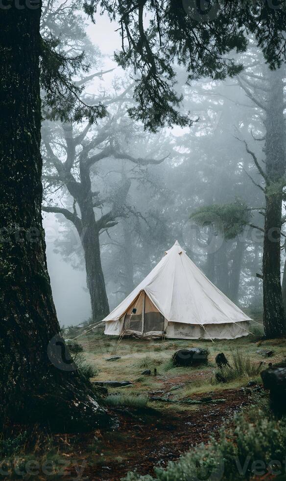 Ethereal tent nestled within a misty forest landscape offering solitude and a peaceful escape into nature photo