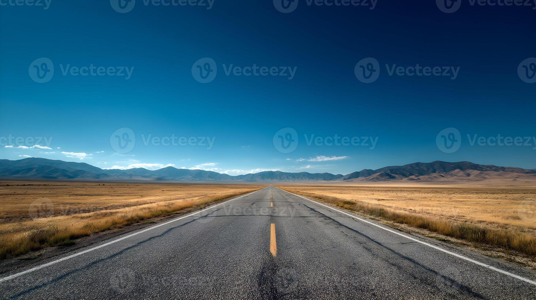 Open road under a vast sky leading toward distant mountains inviting adventure and exploration photo