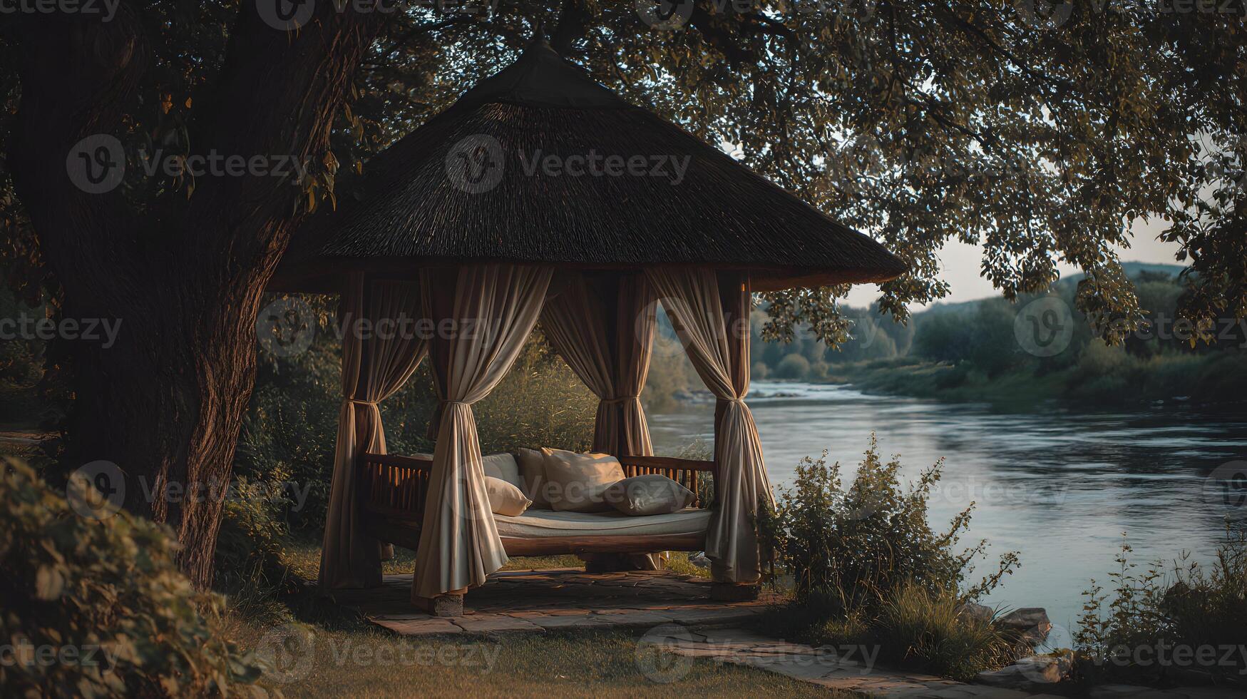 Peaceful riverside gazebo with flowing curtains and serene water view on a tranquil morning photo