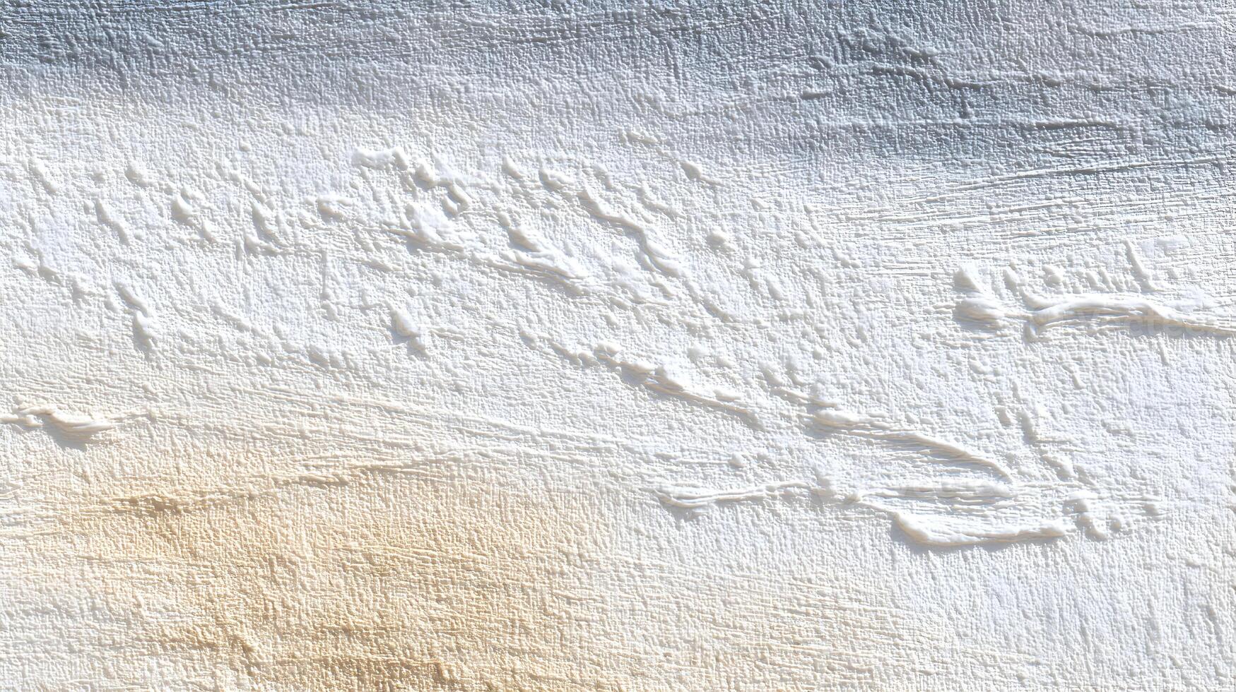 Textured plaster wall with subtle gradations offering a unique artistic and versatile design element photo