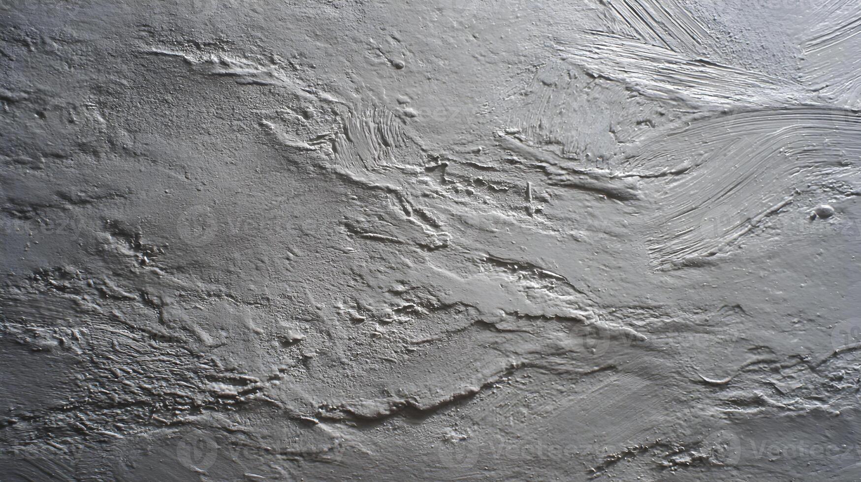 Abstract texture of grey paint strokes on a rough surface creates depth and tactile sensation revealing artistic creation photo