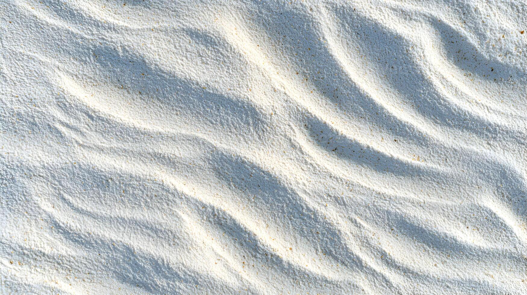 Serene ripples and gentle contours grace a pristine white beach creating a soft textured surface illuminated by sunlight photo
