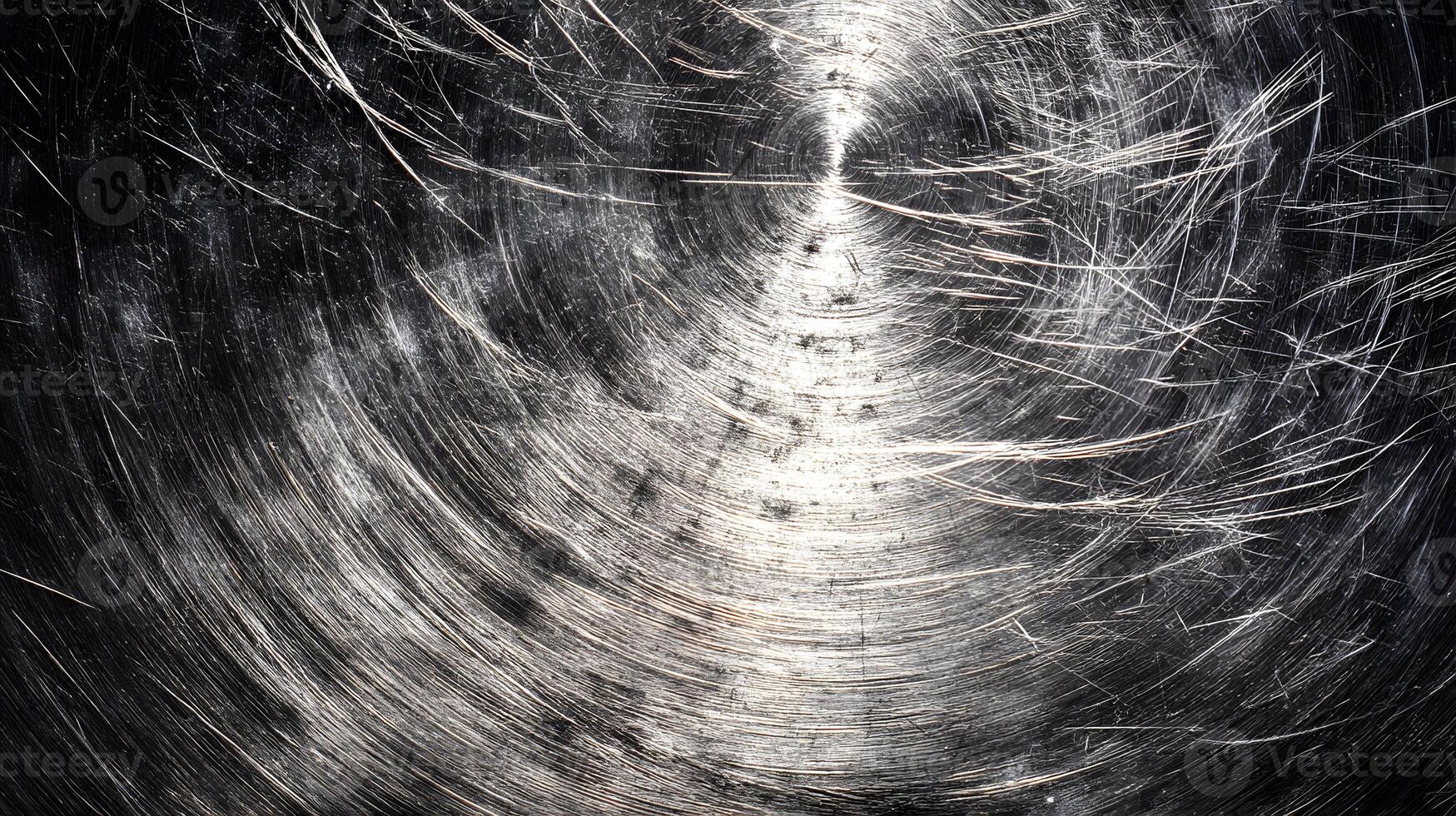 Circular brushed metal texture with scratches creates a dynamic industrial feeling surface design photo