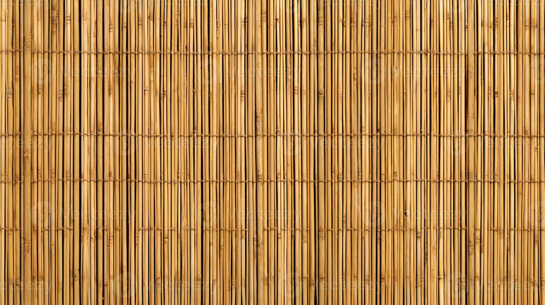 Natural bamboo screen texture forms a warm and earthy background creating a rustic visual appeal and design element photo