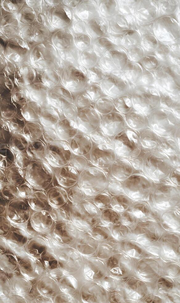 Captivating close up of pristine bubble wrap material showcasing abstract patterns and delicate textures suitable for design photo