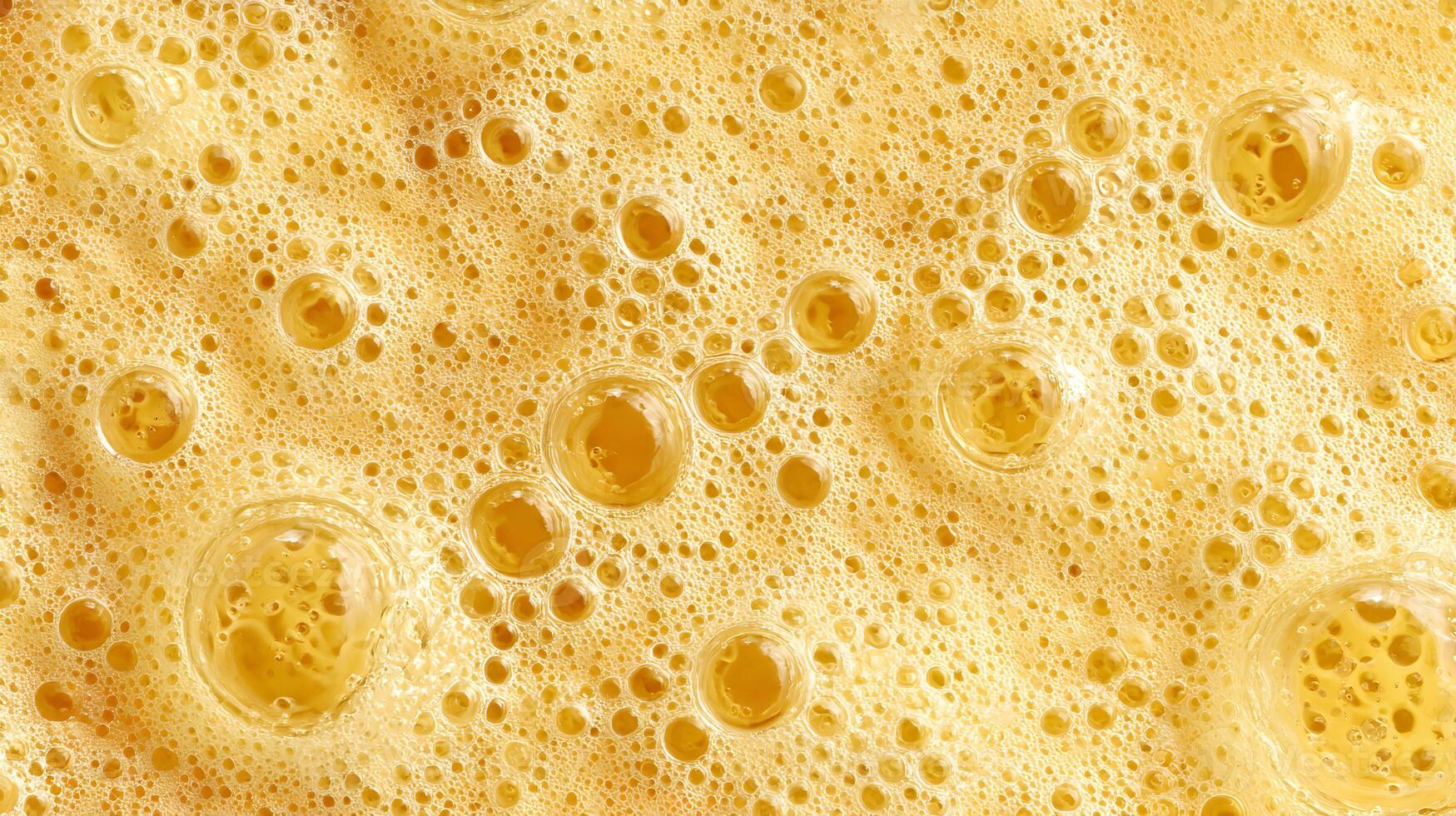 Golden bubbly texture creates a beautiful abstract background with liquid bubbles and foam design photo