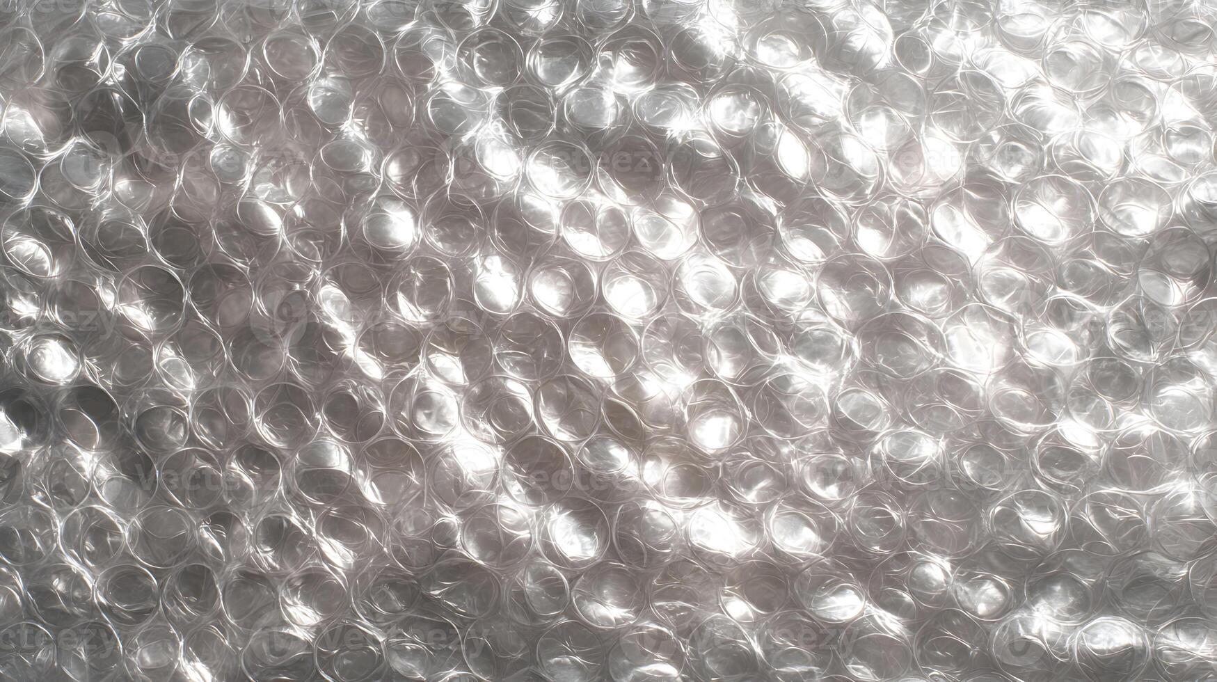 Abstract background of shiny bubble wrap with circular shapes and reflections creating a modern aesthetic photo