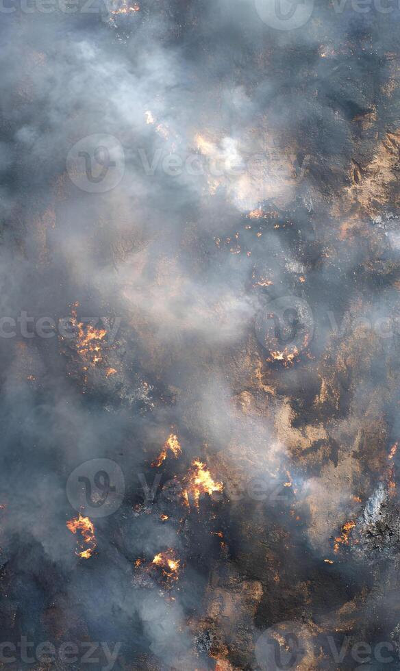 Aerial view of a landscape engulfed in wildfire, with intense flames and thick smoke blanketing the area revealing the destructive force of nature photo