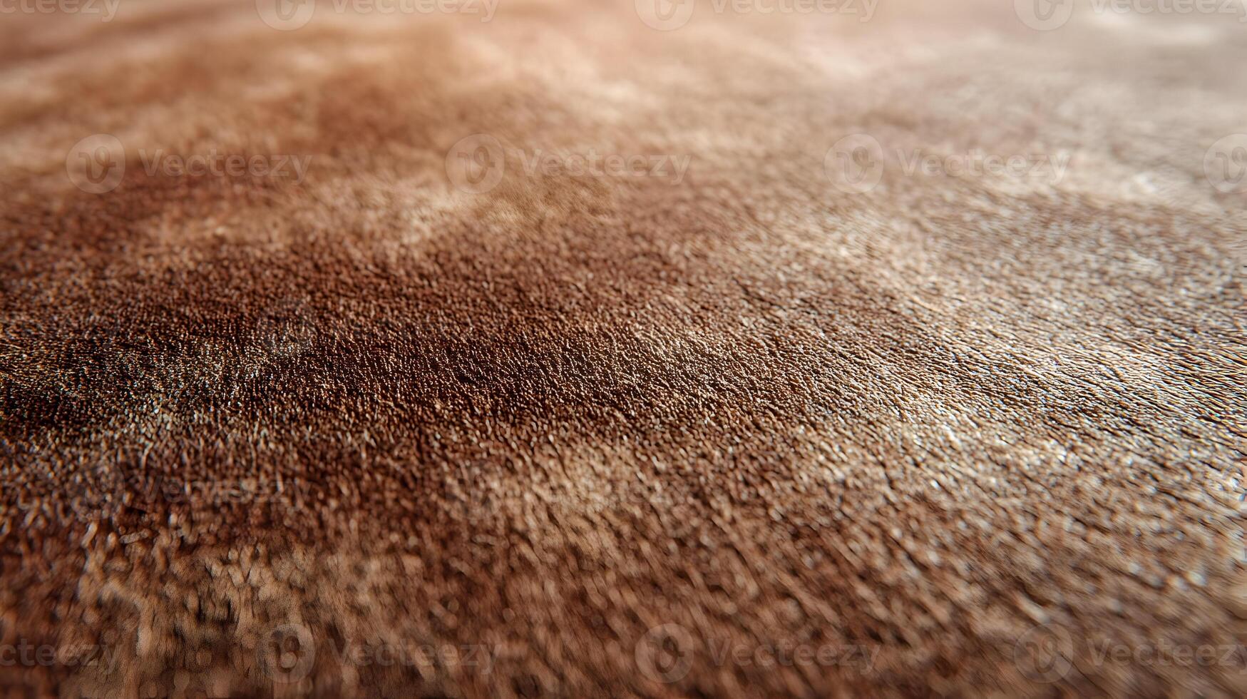 Detailed view of a brown animal hide surface showing texture and subtle color variations close up shot photo