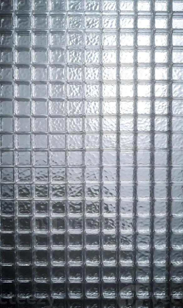 Subtle interplay of light and shadow on textured glass surface creating a serene and elegant aesthetic photo