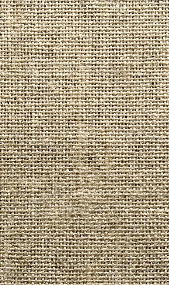 Detailed capture of burlap fabric revealing intricate weave showcasing natural textures and rustic warmth perfect for backgrounds photo