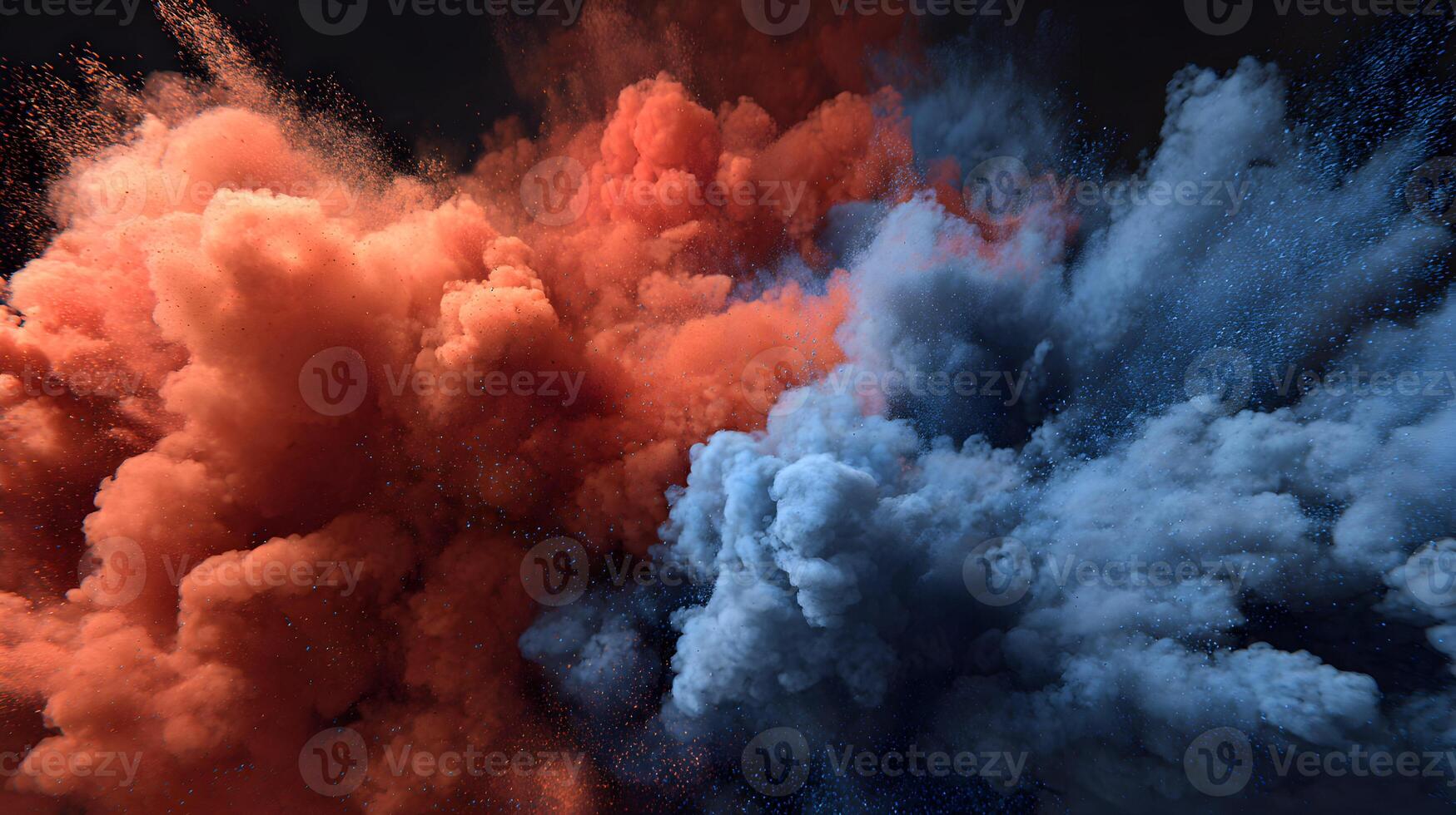 Explosive display showcasing a vibrant fusion of orange and blue powder against a dark backdrop photo