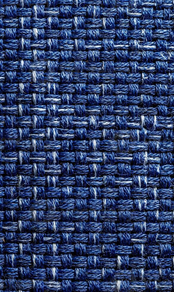 Detailed close up showcasing a woven fabric texture in varying shades of blue emphasizing depth and pattern intricacy photo