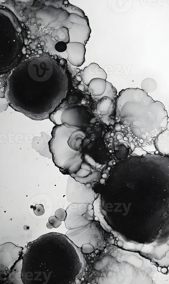 Monochrome abstract art showcasing ink droplets merging in a fluid pattern creating a mesmerizing effect photo