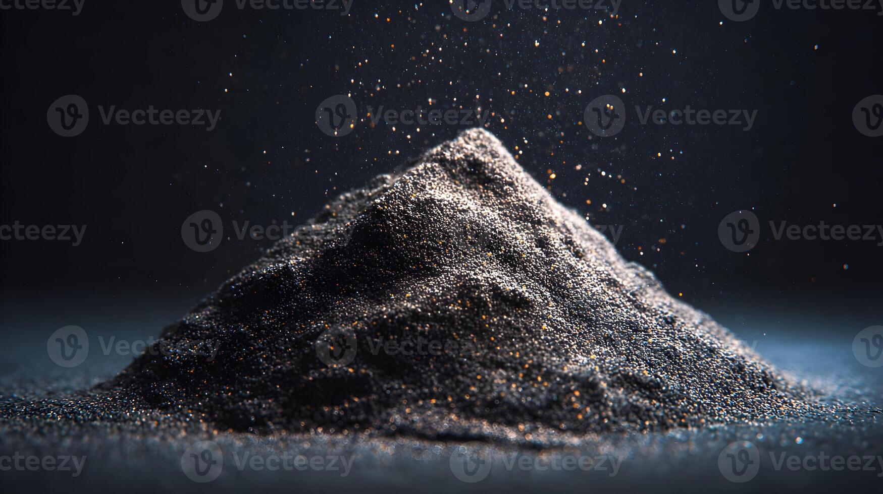 Mysterious pile of black sand with shimmering sparkles evoking a sense of dark magic and mystery photo