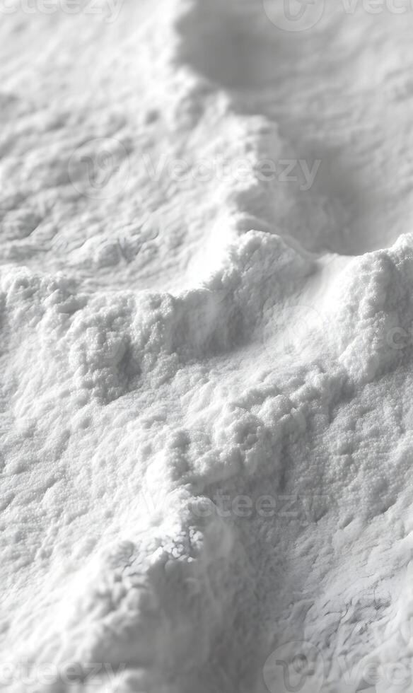 Intriguing crystalline texture of white powder forming wave like patterns under bright light conditions photo