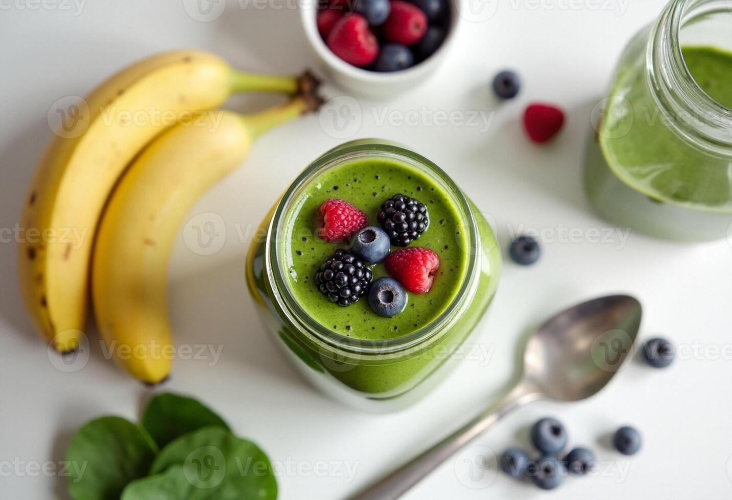 Green smoothie with berries and bananas photo