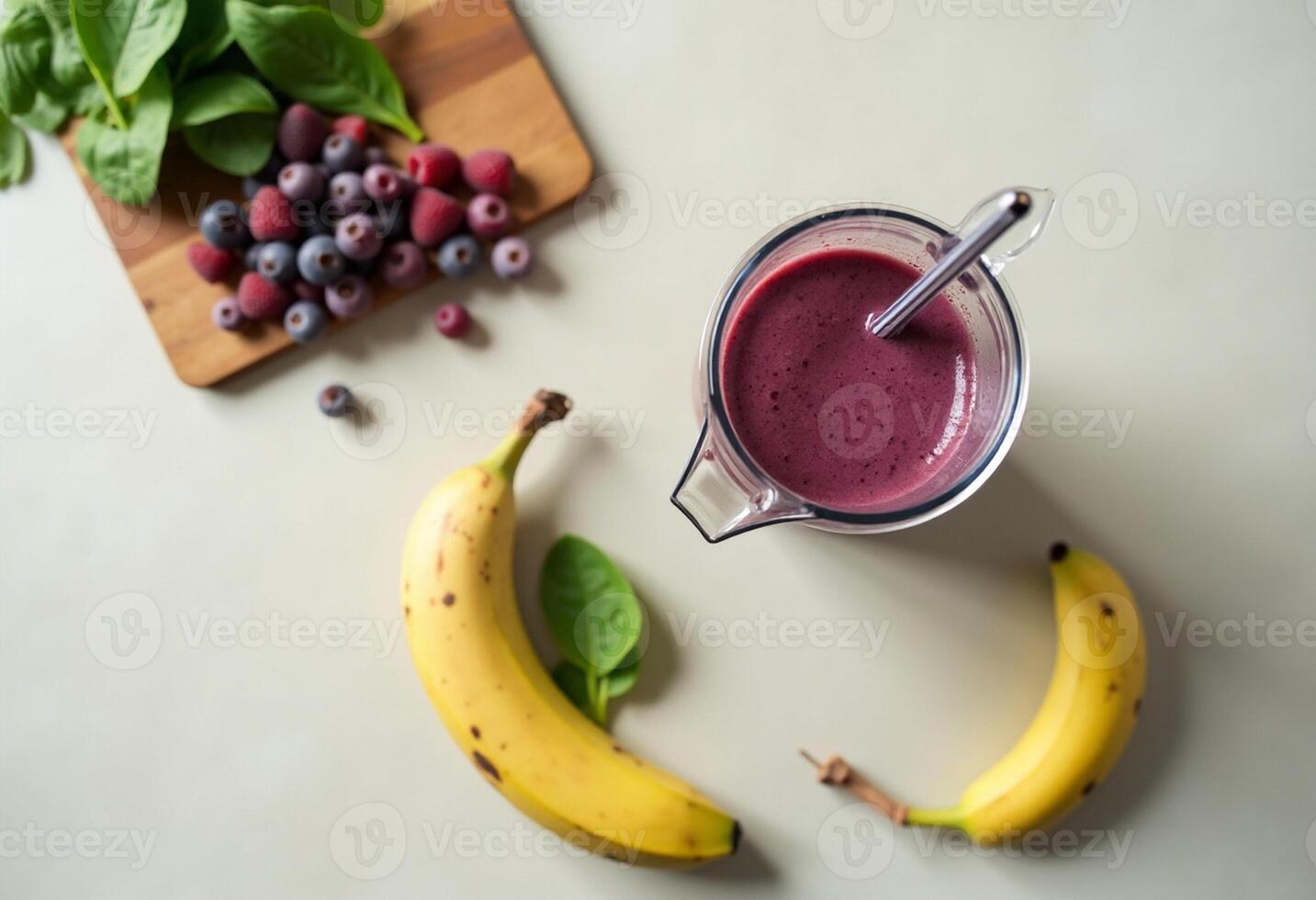 A smoothie with berries and bananas on a table photo