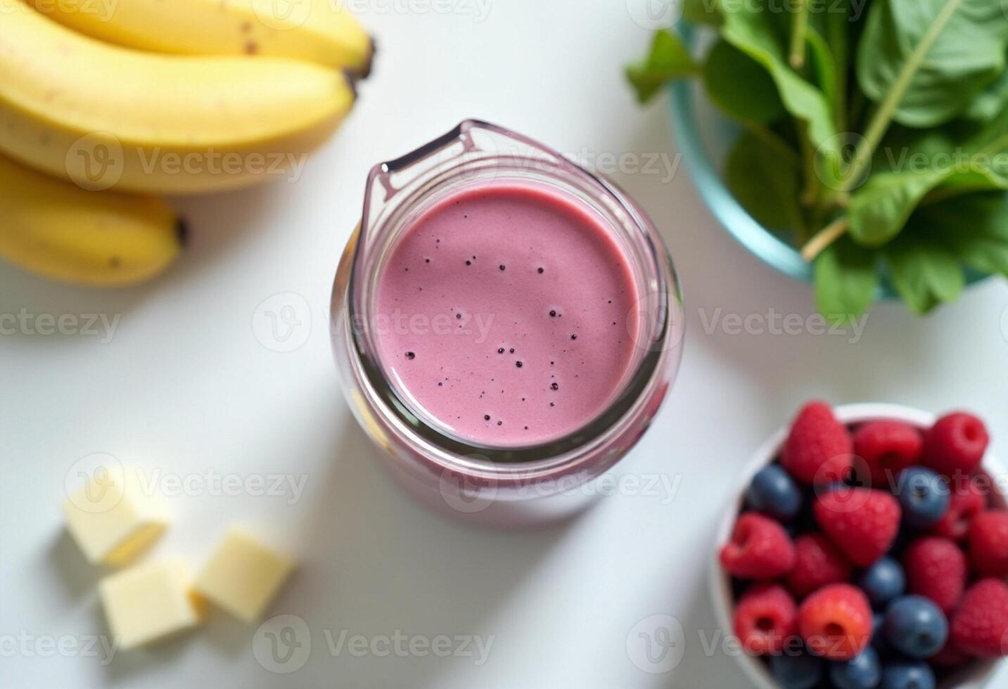 A smoothie with bananas, raspberries and blueberries photo
