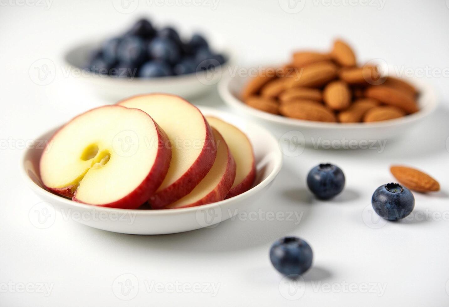 A bowl of sliced apples and blueberries photo